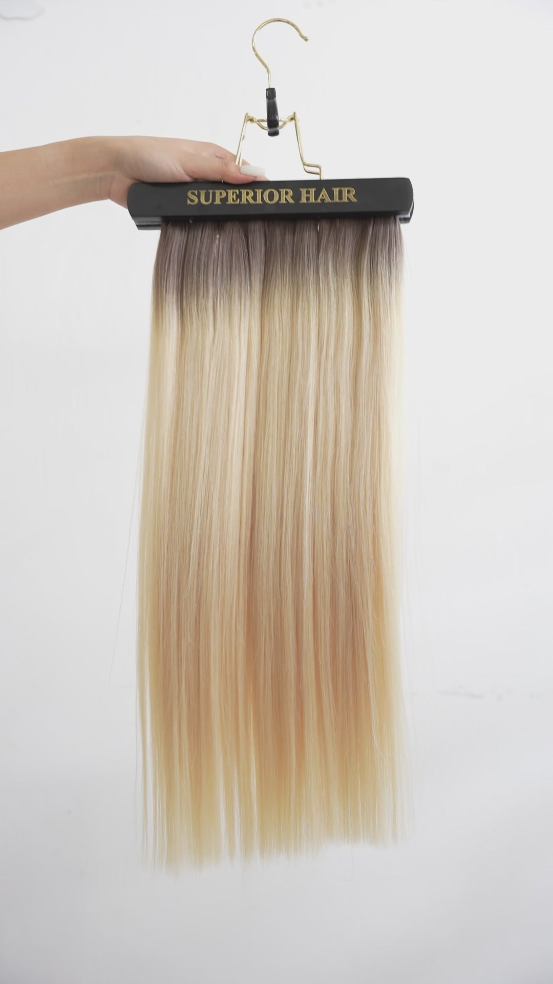 Load video: #Rooted Hollywood Blonde Halo Hair Extensions
